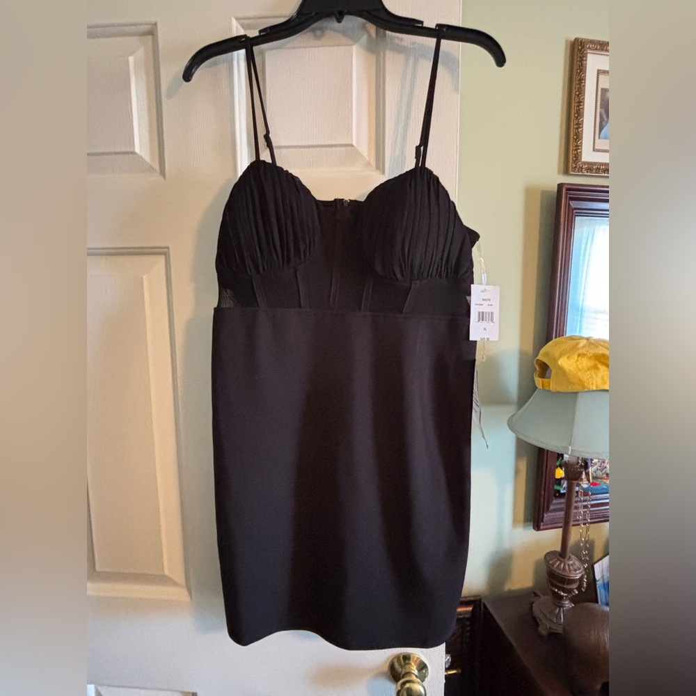 New with tags, black semi-formal cocktail dress. Size XL.